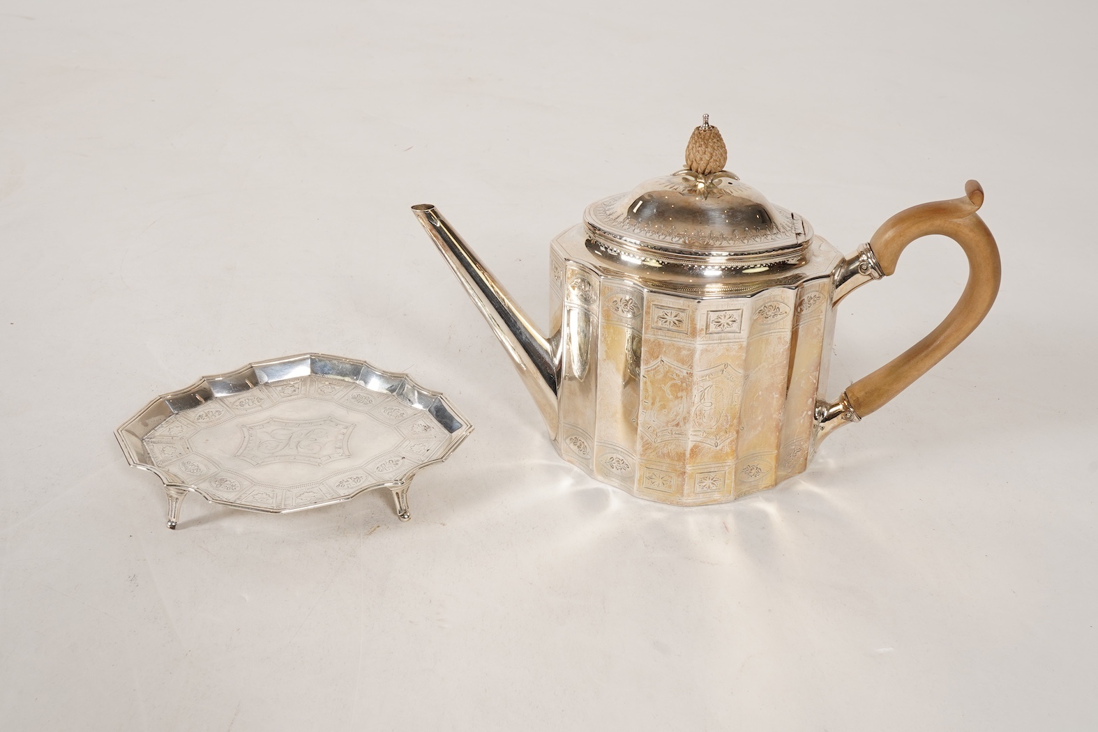 A George III bright cut engraved silver teapot and matching stand by Robert Hennell I